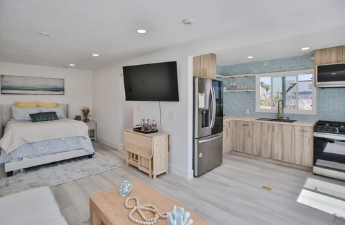 Huntington Harbour Cottage | STEPS TO PRIVATE BEACH FRONT PANORAMIC OCEAN VIEWS! Home - parking lot - sand.