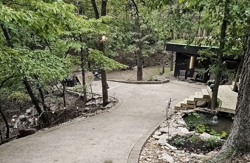 Lost Bridge Village House | Charming Retreat with Luxurious Amenities and Unique Cave Features