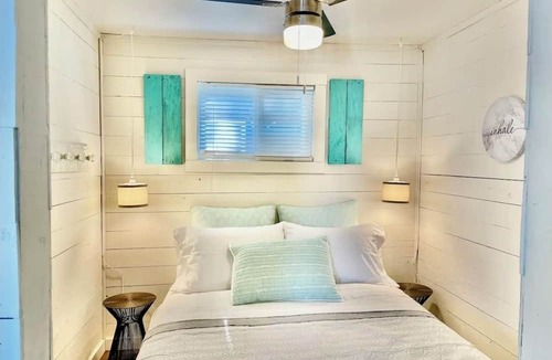 Westmeath Cottage | The Little Blue Beach House waterfront with shallow and sandy beach dog friendly