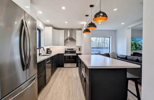Lafontaine Cottage | Modern Cozy Container Home with Close Proximity to Multiple Beaches