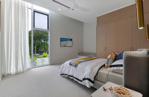 Mermaid Waters Villa | Architectural Masterpiece on Wide Water