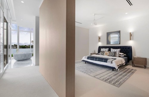 Mermaid Waters Villa | Architectural Masterpiece on Wide Water