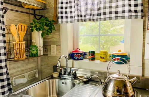 Joseph Cottage | Camp-themed dog-friendly cabin with mountain views, firepit, & river access