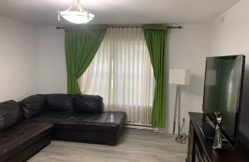 Brandon Apartment | Comfortable Stickney bedroom.