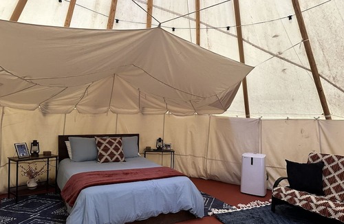 Steelville RV Rental | A teepee on 1200-acre ranch where secluded woods envelope the grounds.