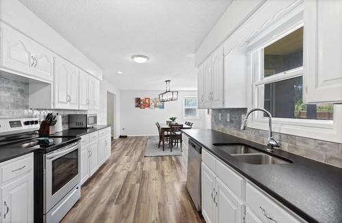 Joplin House | Stylish Rancher in Quiet, Tree Lined Neighborhood.