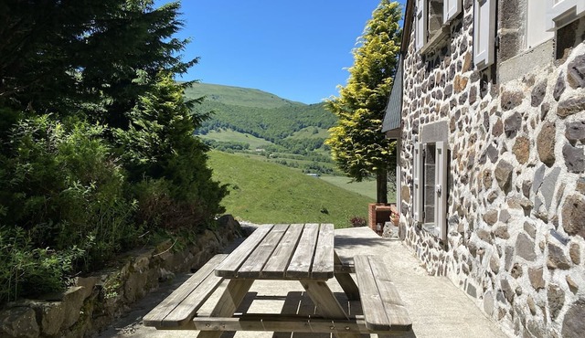 Farmhouse on the mountain overlooking the valley.