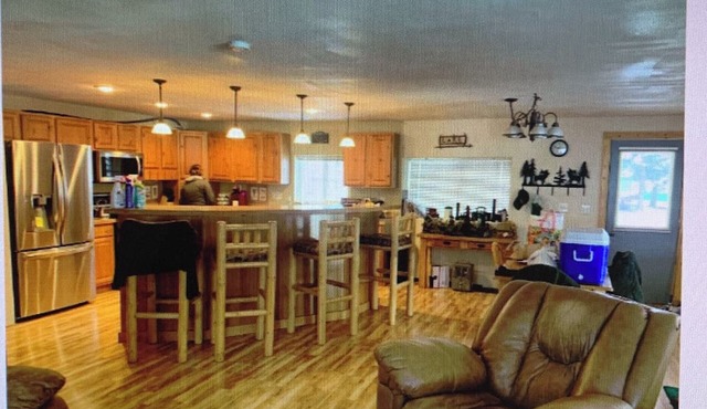 Cozy cabin on a quiet dead end street with a large deck and outdoor kitchen