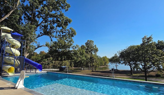 Giant10-bedroom lakefront home with large pool, hot tub, and dock