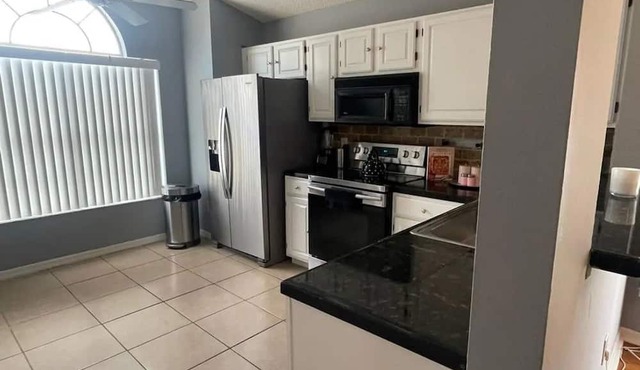 Spacious 4-bedroom house in delightful Davenport with WiFi, AC And Near Disney