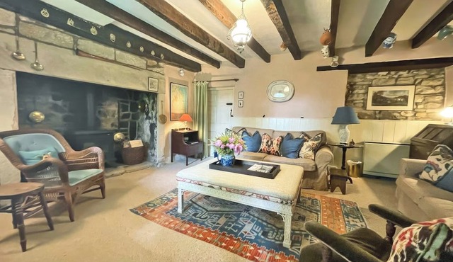 A delightful Grade II listed 18th century cottage in a tranquil rural position.