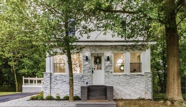 Embrace the charm of our creekside haven featuring 4BR 3BA yoga and BBQ deck.