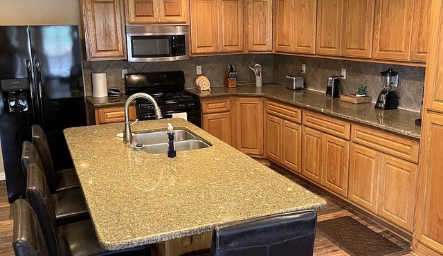 Ride to the ATV trails from this Spacious 4-bedroom house with RV hookup!