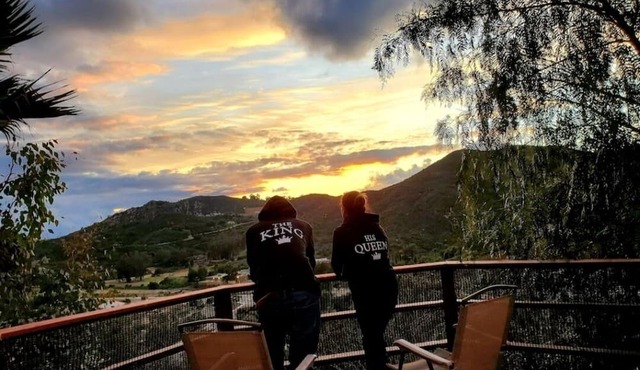 Beautiful luxurious house looking at canyon and mountains, gorgeous sunset.