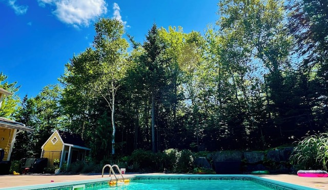 Charming family home with in-ground heated pool. Close to parks, lakes, & trail.