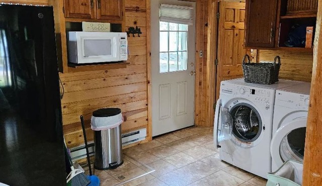 1 bedroom/1 bath cabin house with garage! Large front & back deck w/big backyard
