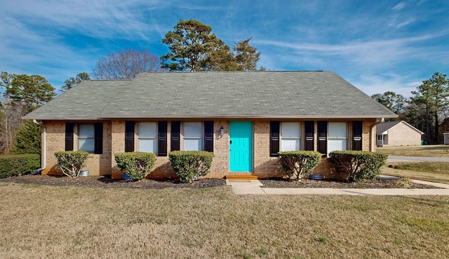 Perfectly located home with deck, open layout, smart TVs, central AC, & W/D