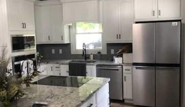 On a Grand Lake channel and walking distance to bike path, marina, and bar.