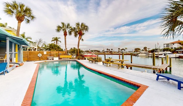 Renovated, waterfront townhome with pool & dock - walk to the beach