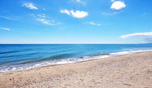 Beautiful and modern vacation home with communal pool and sea view from the terrace.