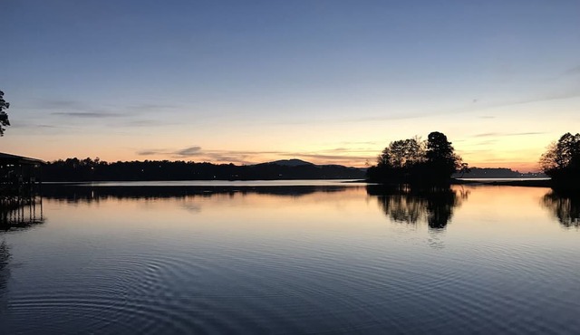 Lovely Lakefront House with level backyard with beautiful sky/sunset views!
