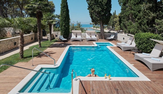 Villa Diocletian's Palace with a pool near the sea