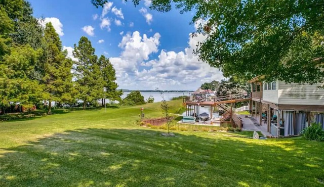 Idyllic lakefront oasis with private hot tub, fire pit, deck, & incredible views