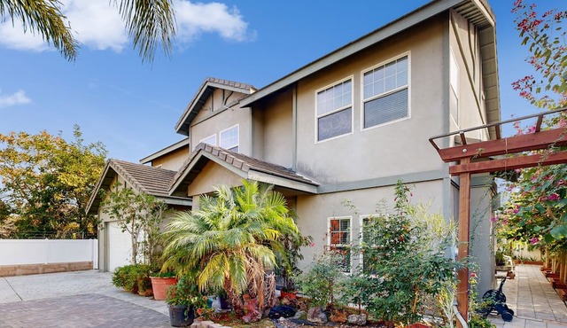 Centrally located home with private patio, updated interior, fireplaces, & W/D