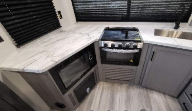 Come play with Scottish highland cows in a beautiful and cozy brand new RV!