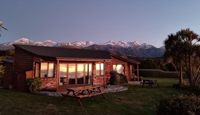 Unwind and rejuvenate amidst the scenery of the ocean and snow-capped mountains.