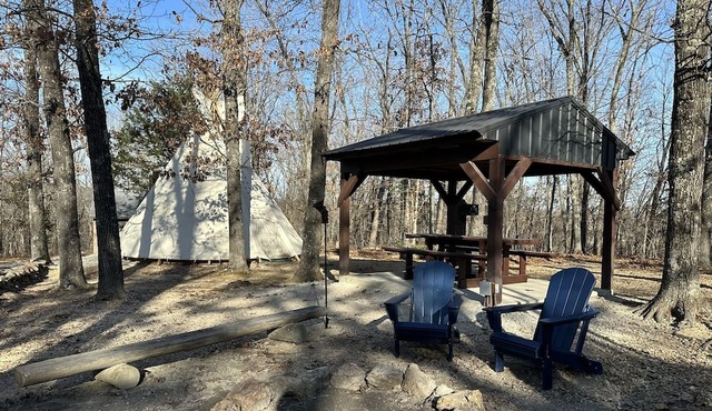 A teepee on 1200-acre ranch where secluded woods envelope the grounds.