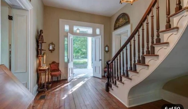 Historic Idlers BNB Retreat on two acres with an Olympic sized pool.