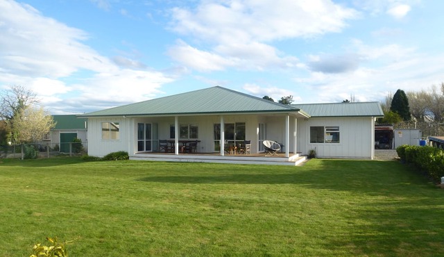 House amoungst a vineyard and orchard