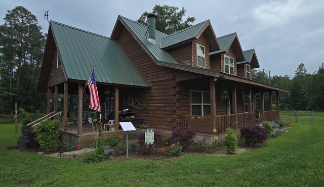 3-bedroom log cabin backs up to wooded lot for maximum peace and quiet!