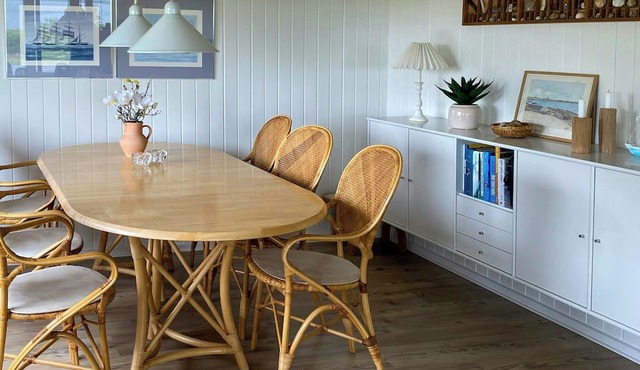 Cottage with water view by protected coastline